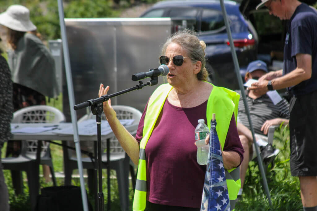 Hanscom Field Advisory Commission Acton representative Terri Ackerman speaks during a July 31 protest. Photo: Dakota Antelman/The Acton Bridge