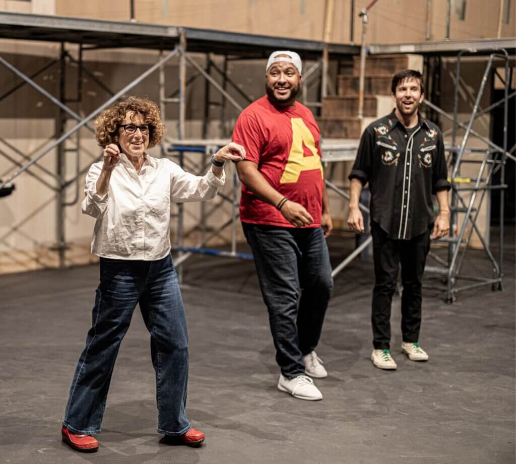 Left to right: Ilyse Robbins directs Anthony Pires Jr. (playing Michael) and Johnny Shea (Jon) in a rehearsal for “Tick, Tick… Boom!”