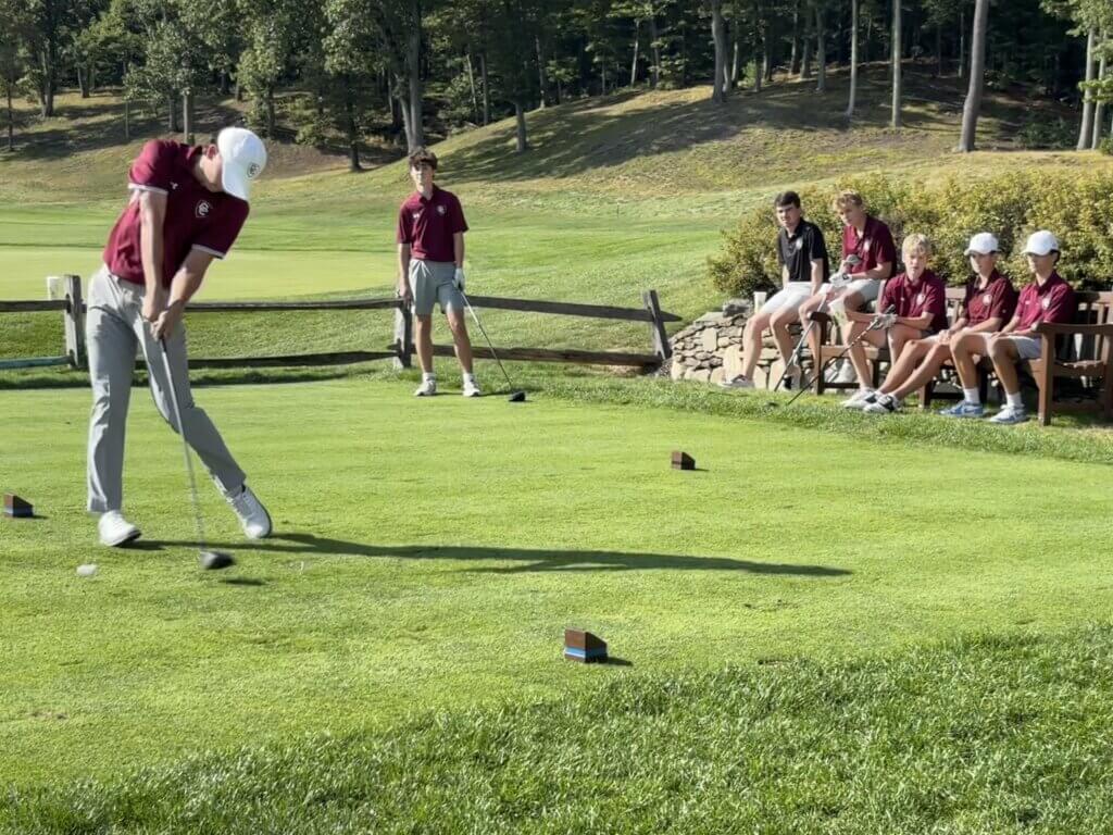 Calvin Alexander tees off against Boston Latin at Acton Country Club on September 9. Photo by Carl Sweeney