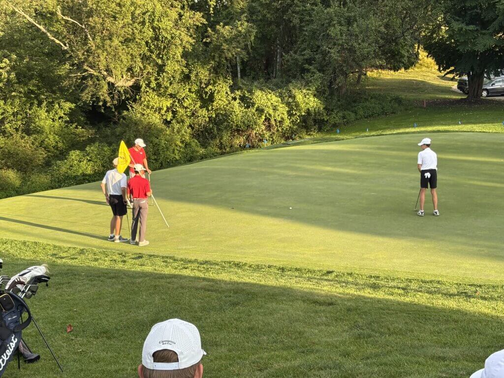 Tate Miller lags a putt close on the ninth green at Acton Country Club on September 10. Photo by Carl Sweeney