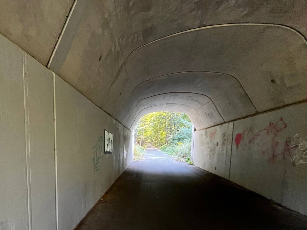 The Bruce Freeman Rail Trail tunnel on Powder Mill Road is regularly tagged. Courtesy photo