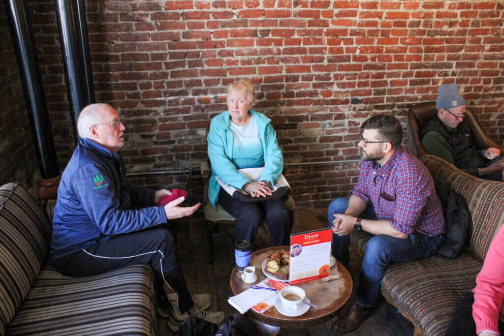 Finance Committee member Gerard Jansen, left, speaks with School Committee hopeful Drew Magliozzi at Caffè Nero in Acton Center. Photo: Dakota Antelman/The Acton Bridge