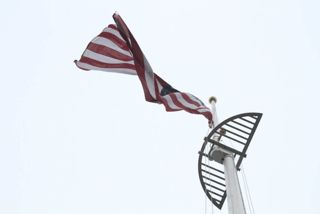 The American flag flies over Acton.
