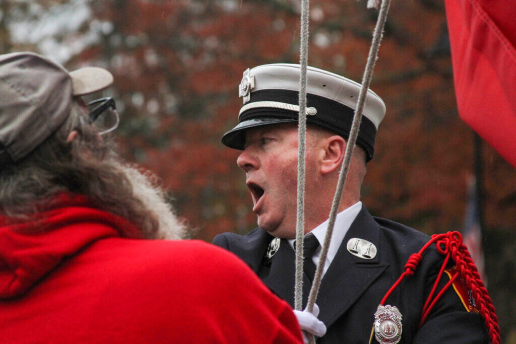 Murphy shouts a command to the assembled color guard.