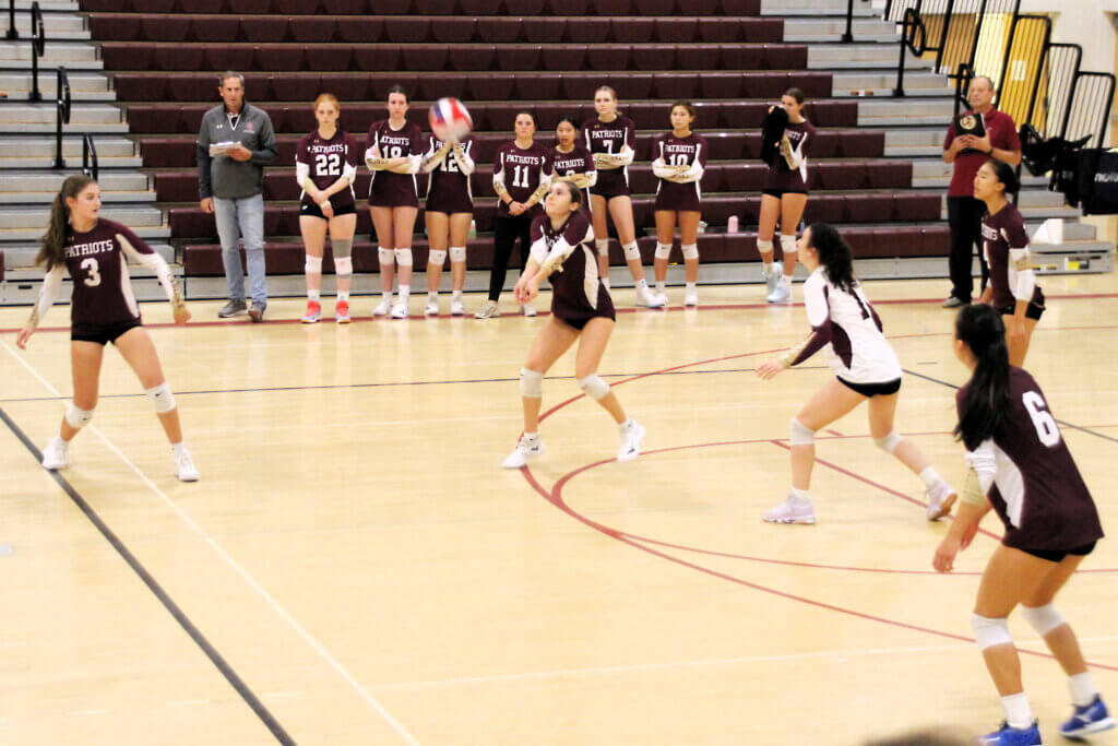 Junior Bella Cuozzo passes a serve to start the offense against CRLS. Photo by Debra Antonangeli