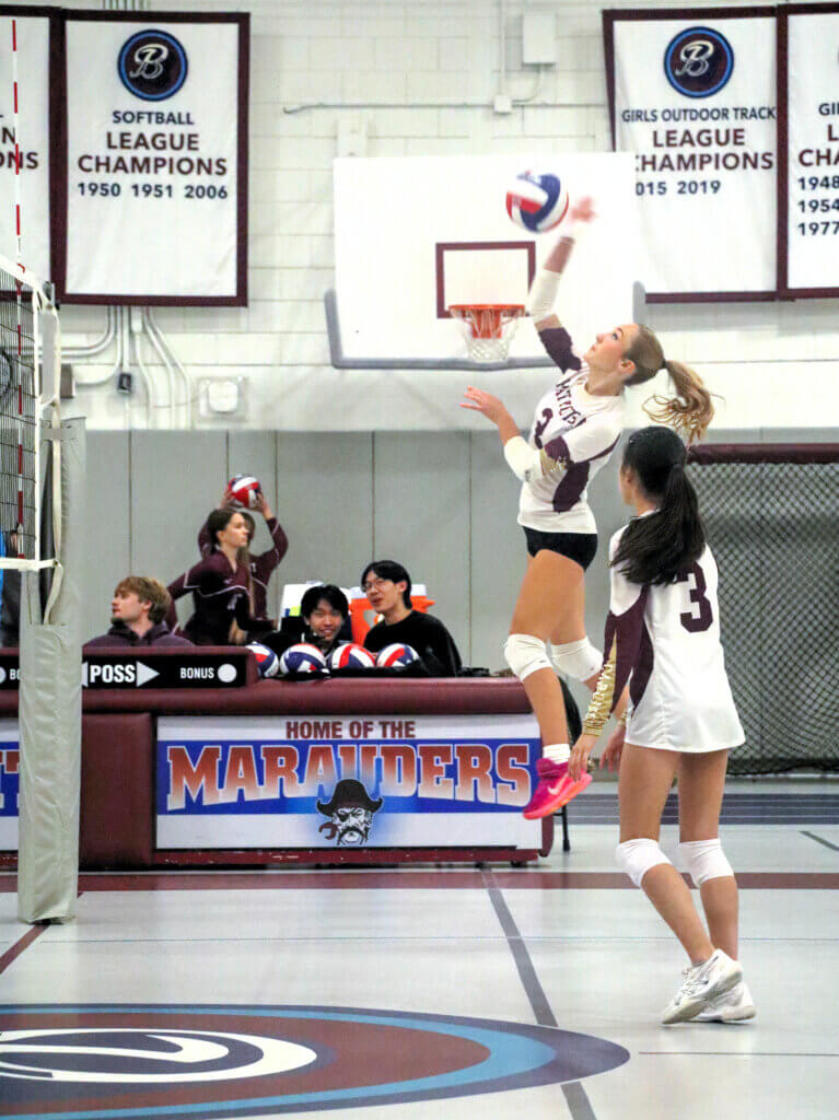 Acton-Carlisle’s Adrienne Venesy delivers a spike against Belmont on October 9. Photo by Debra Antonangeli