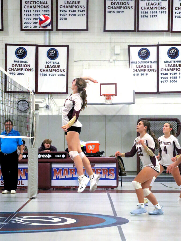 Acton-Carlisle’s Sadie Constable gets ready to spike the ball against Belmont on October 9. Photo by Debra Antonangeli
