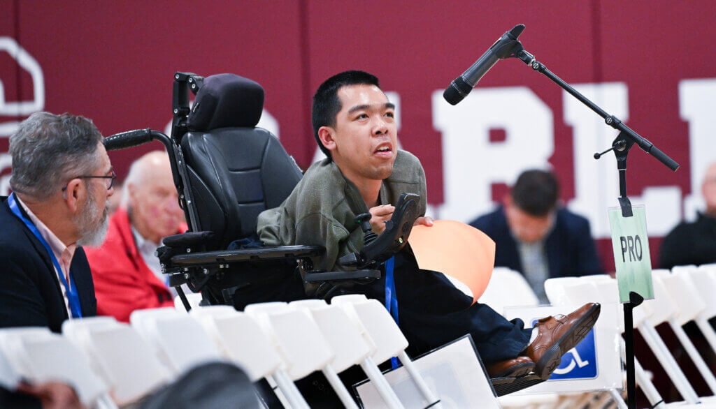 Voter Justin Moy speaks in favor of an amenities building at Acton-Carlisle High School’s Memorial Field during Monday night’s Town Meeting session. Photo: Ken McGagh/The Acton Bridge