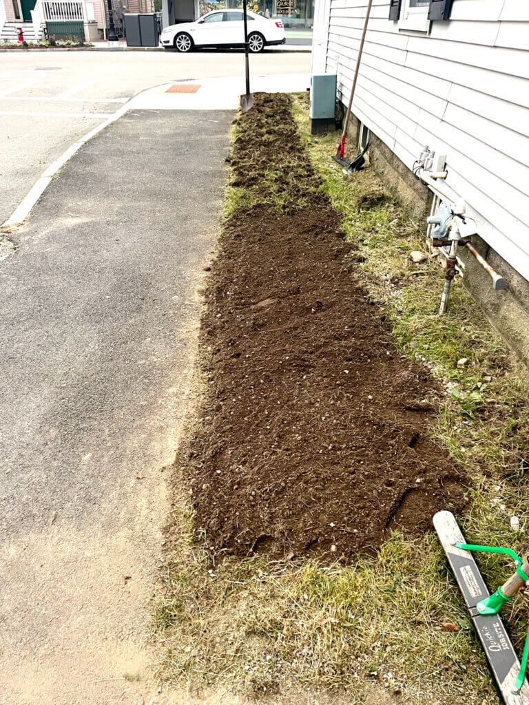 Anita Opitz and Janet Anderson pulled out weeds and prepared the soil to install a garden. Courtesy photo