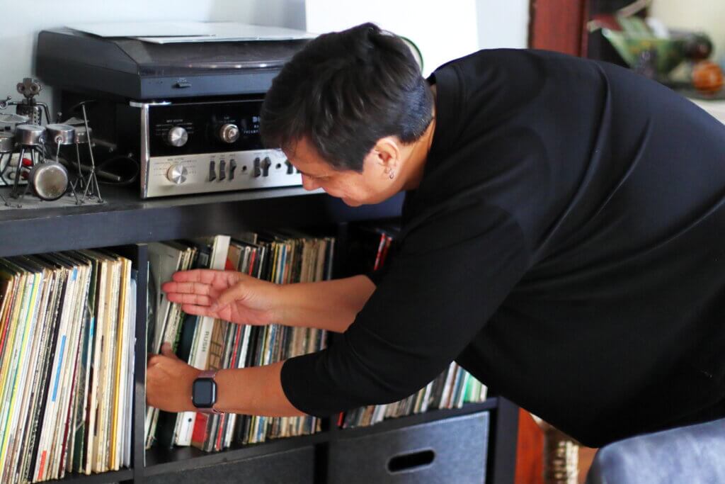 Jennifer Montbach shows off her and her husband’s vinyl record collection. Photo: Trace Salzbrenner/The Acton Bridge