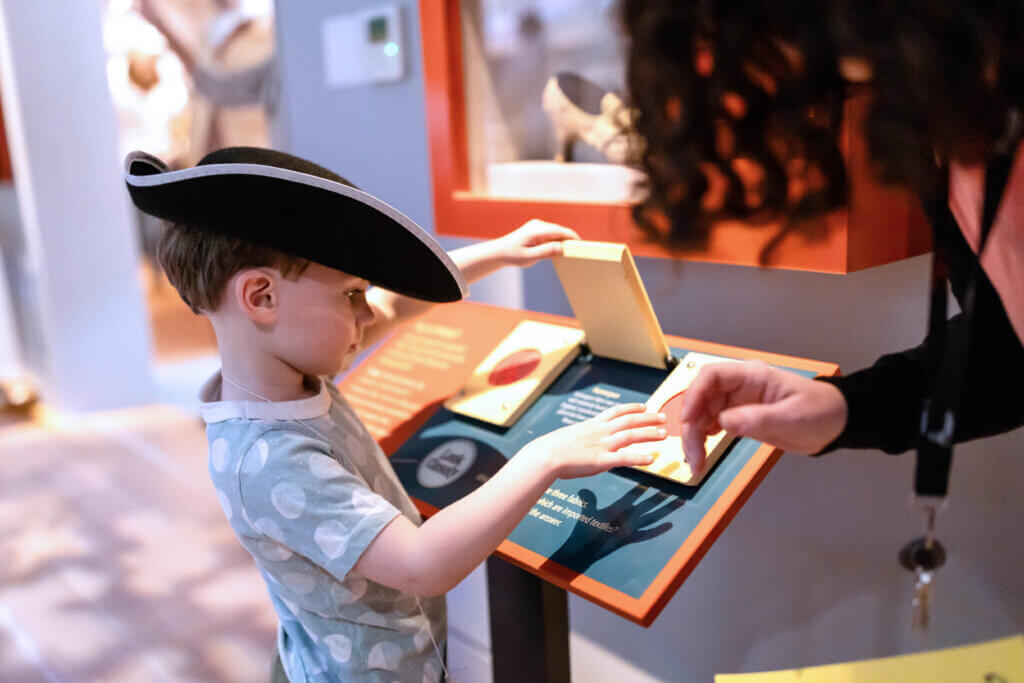 A young visitor gets into the Patriot spirit at the Acton Museum. Courtesy photo