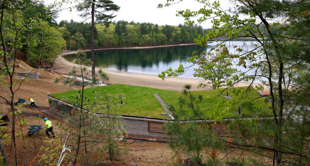 The new bathhouse, with a lawn on the roof, blends in with the scenery at Walden Pond on Wednesday, May 13, 2026. Ken McGagh/The Acton Bridge