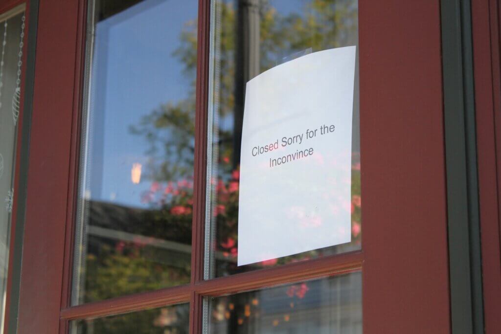 A sign hung on the door of Woods Hill Table on September 17. Photo: Dakota Antelman/The Acton Bridge