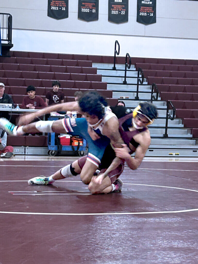 Ammar Bagasra delivers a pin against Lincoln-Sudbury. Photo by Ted Myles