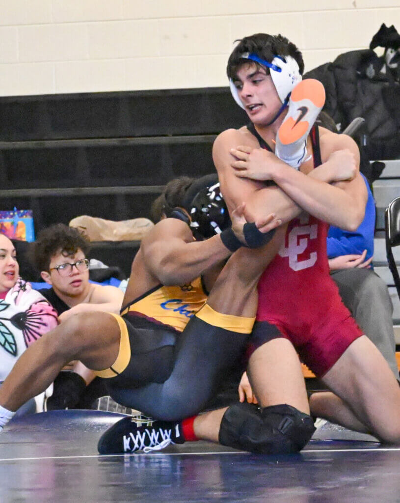 Kyle Amouzgar pressures No. 2 state-ranked Michael Jenkins of Chicopee. Photo by Kim Amouzgar