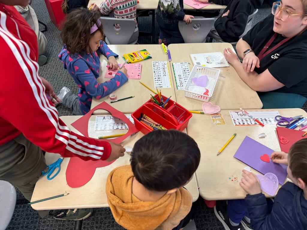 Thoreau fifth graders helped kindergartners craft their Valentine’s Day missives. Courtesy photo